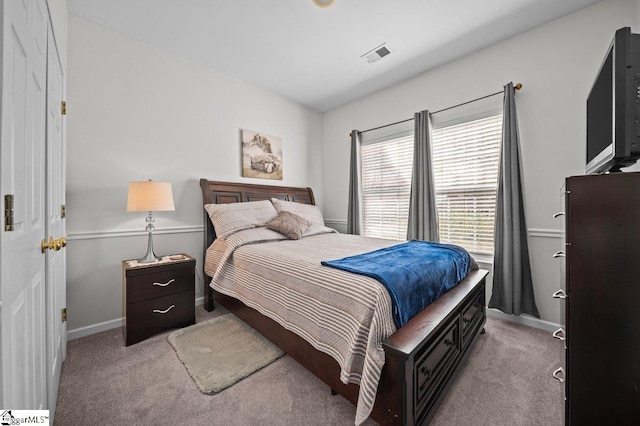 bedroom with visible vents, baseboards, and carpet flooring