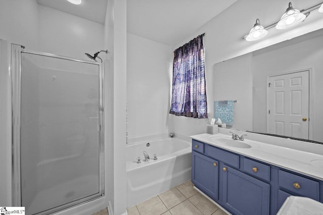 full bath featuring tile patterned flooring, a stall shower, vanity, and a bath