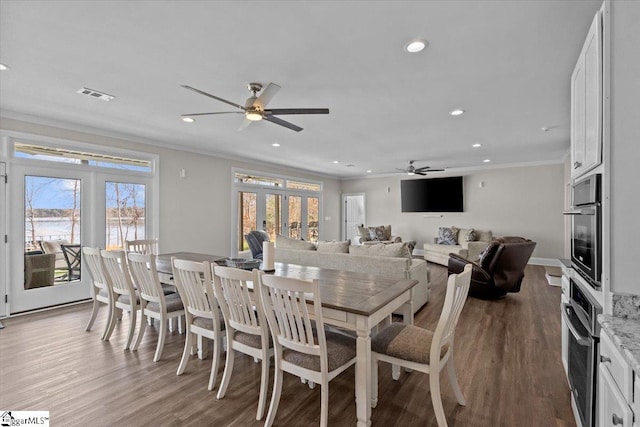 145 Brady Dr, Anderson, SC 29626 - dining space featuring visible vents, wood finished floors, recessed lighting, french doors, and crown molding