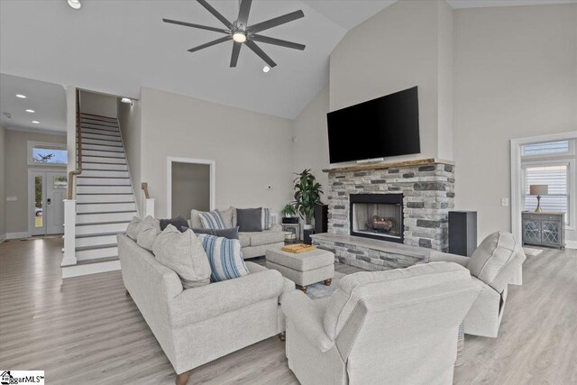 145 Brady Dr, Anderson, SC 29626 - living area featuring high vaulted ceiling, a ceiling fan, stairway, light wood-style floors, and a fireplace