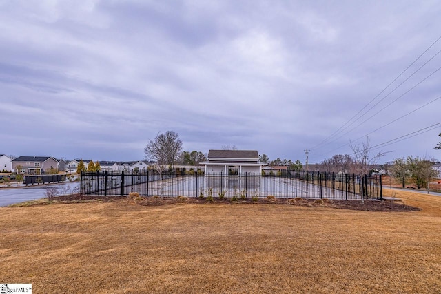 view of yard with a residential view and fence