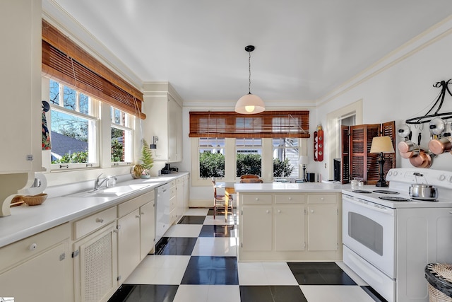 kitchen featuring light countertops, ornamental molding, tile patterned floors, white appliances, and a sink