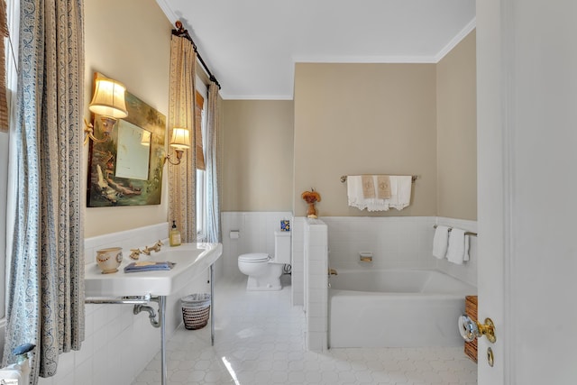 full bath featuring toilet, tile walls, a bath, and ornamental molding