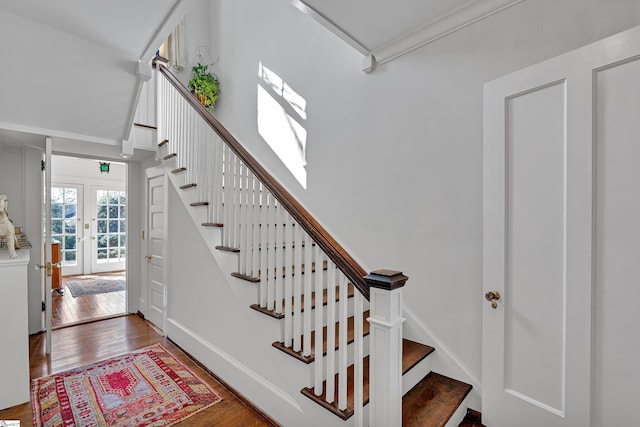 stairway with baseboards and wood-type flooring