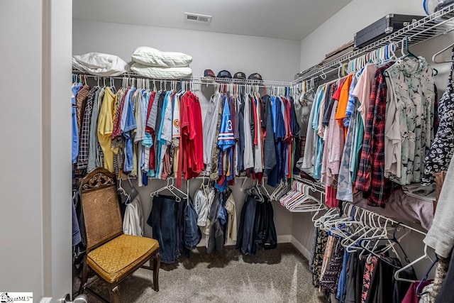 spacious closet featuring visible vents and carpet