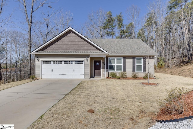 ranch-style home featuring driveway, an attached garage, and roof with shingles