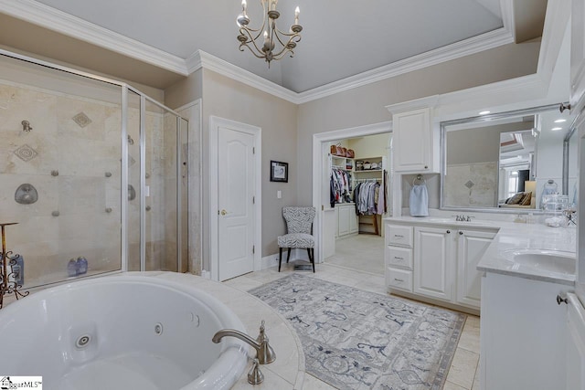 bathroom featuring a tub with jets, a stall shower, vanity, and ornamental molding