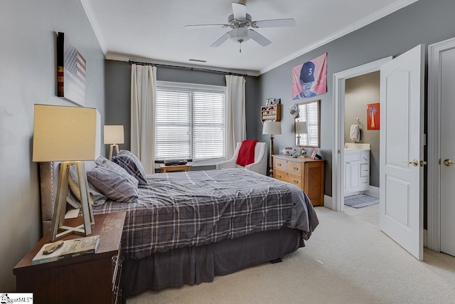 bedroom with visible vents, ensuite bath, ceiling fan, light carpet, and crown molding