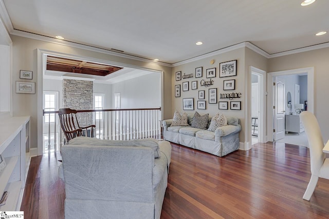 living room with crown molding, recessed lighting, and dark wood-style floors