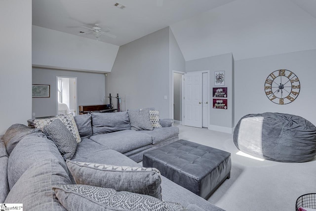 carpeted living room with visible vents, high vaulted ceiling, and a ceiling fan