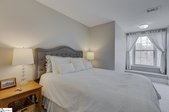 carpeted bedroom with visible vents