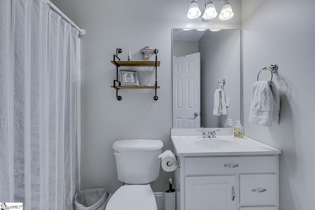 full bath featuring vanity, curtained shower, and toilet