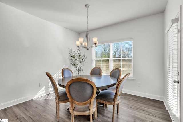 504 Reedy Springs Ln, Greenville, SC 29605 - dining area with baseboards, an inviting chandelier, and dark wood-style flooring