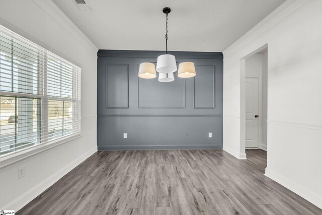 504 Reedy Springs Ln, Greenville, SC 29605 - unfurnished dining area featuring visible vents, wood finished floors, and ornamental molding