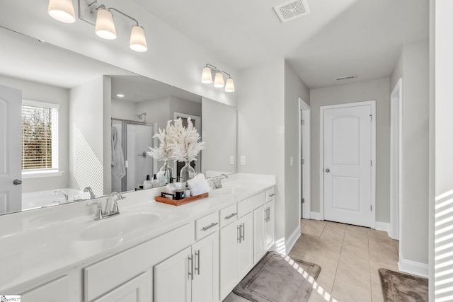 504 Reedy Springs Ln, Greenville, SC 29605 - bathroom featuring tile patterned floors, visible vents, a shower stall, and a sink