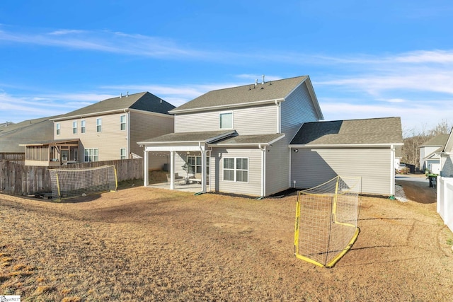 504 Reedy Springs Ln, Greenville, SC 29605 - rear view of property featuring a patio, a shingled roof, and fence