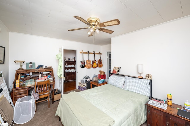 bedroom featuring crown molding, ceiling fan, and carpet floors