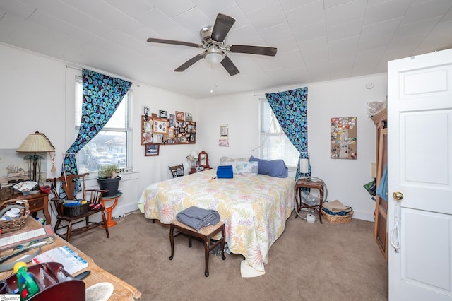 bedroom with light colored carpet and a ceiling fan