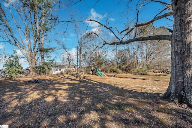 view of yard with a playground