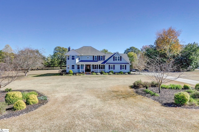 view of front of property featuring covered porch and driveway