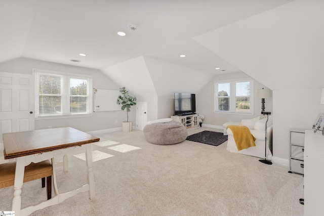 interior space featuring vaulted ceiling, recessed lighting, and baseboards