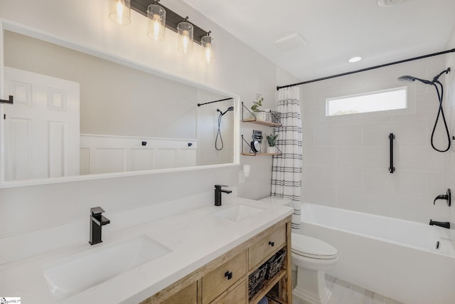 full bath featuring double vanity, shower / bath combination with curtain, toilet, and a sink