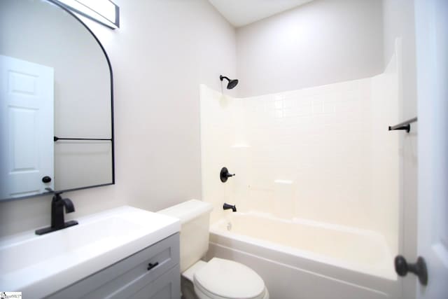 bathroom featuring vanity, toilet, and bathtub / shower combination