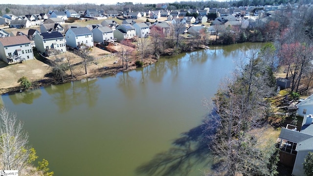 aerial view featuring a residential view and a water view