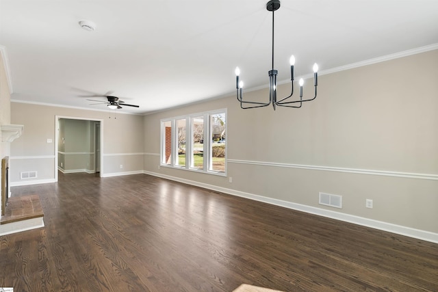 unfurnished living room with visible vents, dark wood-style floors, a fireplace with raised hearth, and crown molding