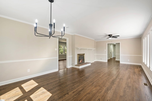 unfurnished living room featuring visible vents, a brick fireplace, dark wood-type flooring, and crown molding