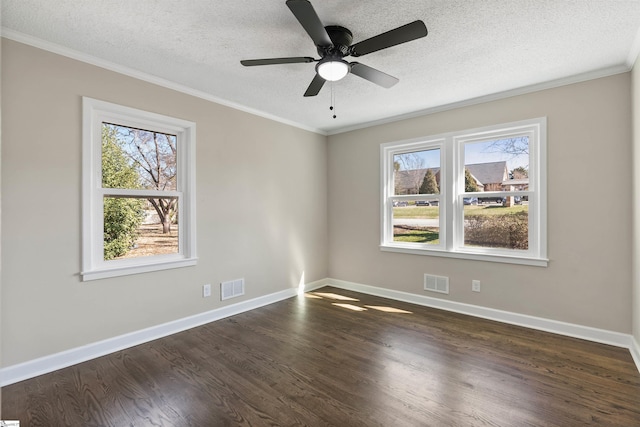 unfurnished room with dark wood finished floors, baseboards, visible vents, and ornamental molding