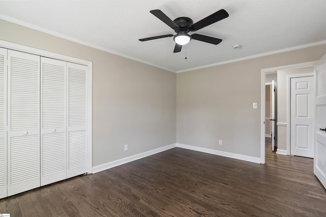 unfurnished bedroom with dark wood-style floors, baseboards, and ornamental molding