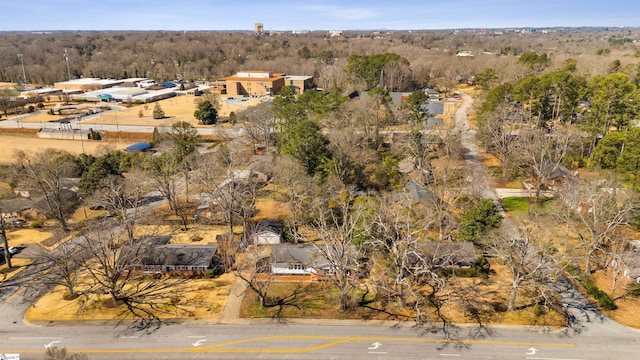 drone / aerial view featuring a view of trees