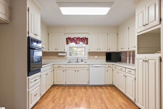 kitchen featuring oven, light wood finished floors, a sink, light countertops, and dishwasher