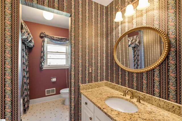 full bath featuring visible vents, wallpapered walls, baseboards, toilet, and tile patterned floors