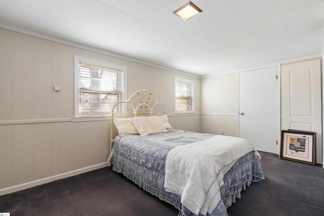 bedroom featuring dark colored carpet