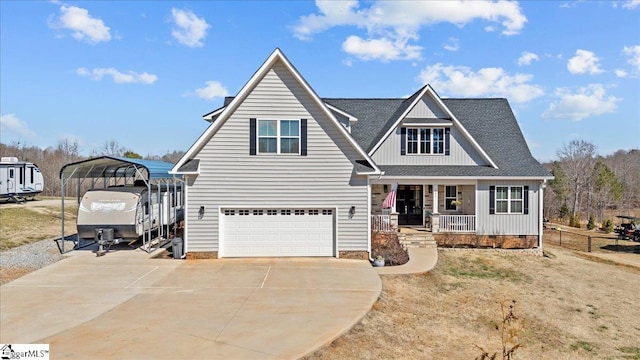 craftsman-style house with a detached carport, roof with shingles, a porch, and concrete driveway