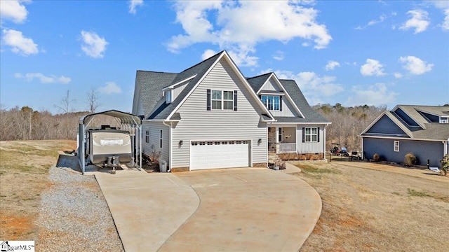 view of front of house featuring a detached carport, covered porch, and driveway