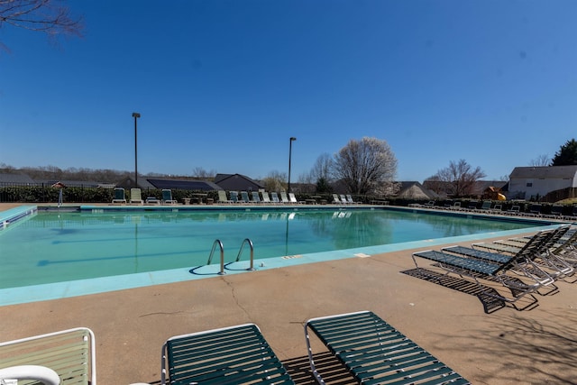 community pool featuring a patio area