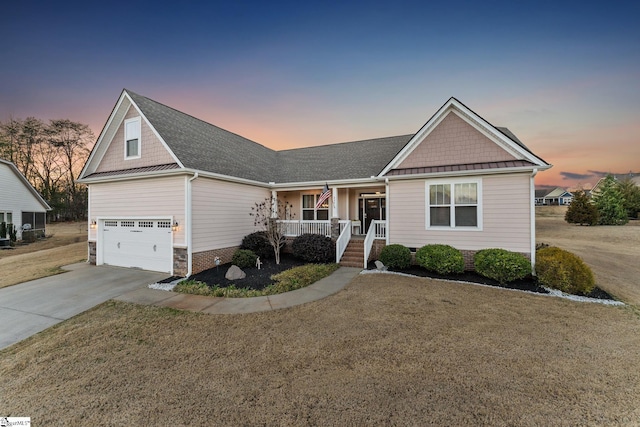 view of front of property with a front lawn, driveway, a porch, an attached garage, and crawl space