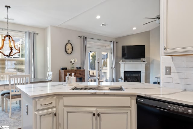 kitchen featuring visible vents, plenty of natural light, and dishwasher