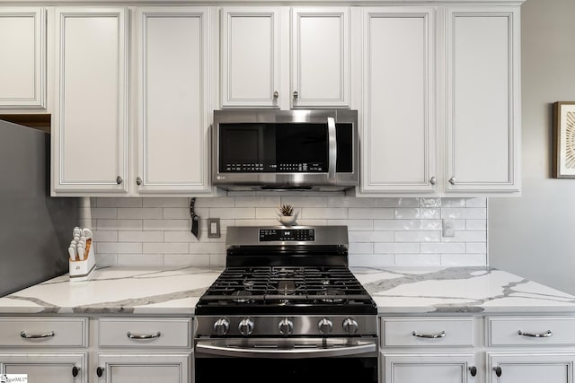 kitchen with white cabinetry and stainless steel appliances