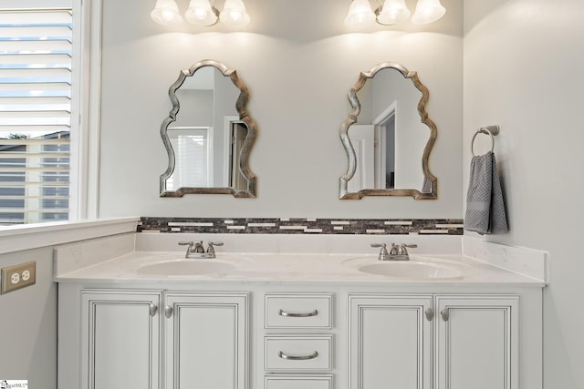 full bath featuring a sink and double vanity