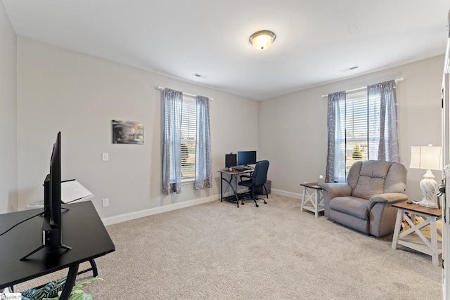 office area featuring baseboards, visible vents, and carpet floors