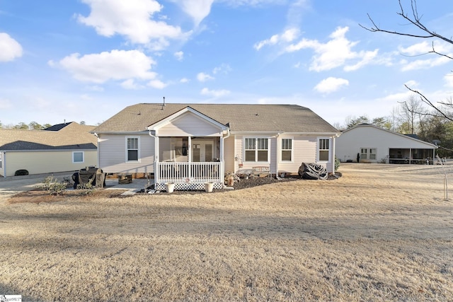 back of property featuring a sunroom