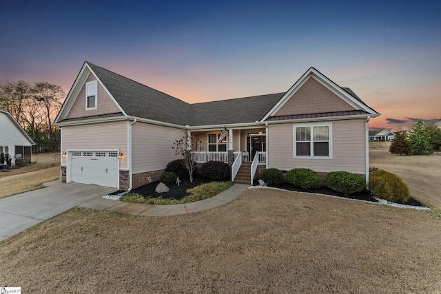 view of front facade featuring a porch, concrete driveway, a lawn, and crawl space