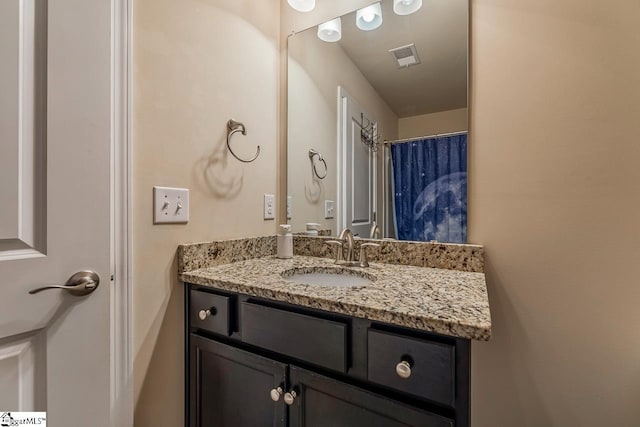 full bathroom with visible vents and vanity