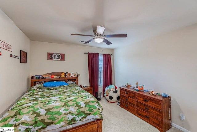 bedroom featuring visible vents, light colored carpet, and ceiling fan