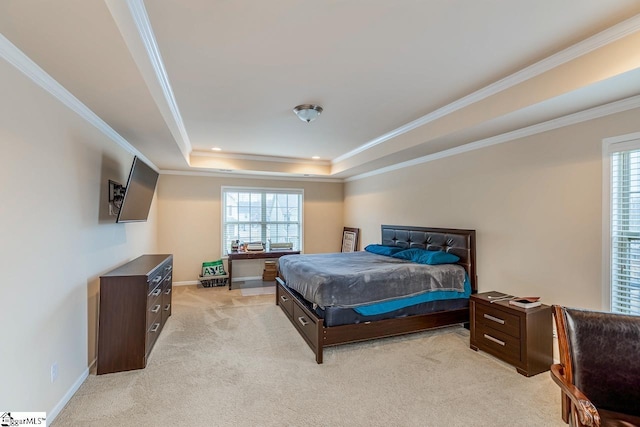 bedroom with light carpet, a tray ceiling, crown molding, and baseboards