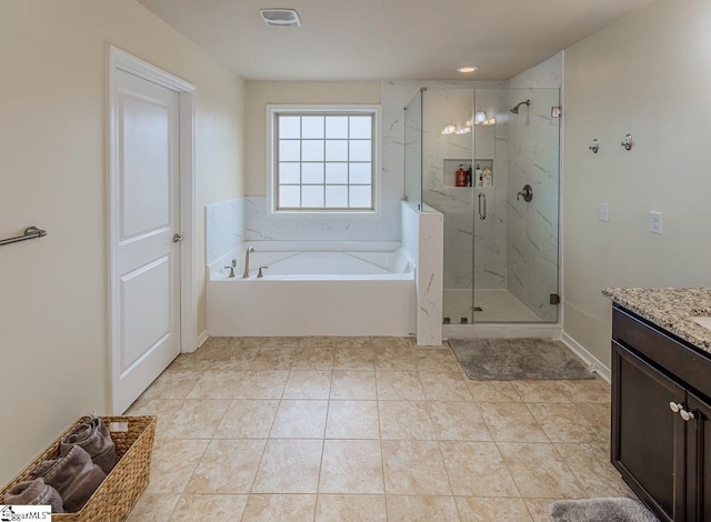 bathroom featuring vanity, visible vents, tile patterned flooring, a shower stall, and a bath